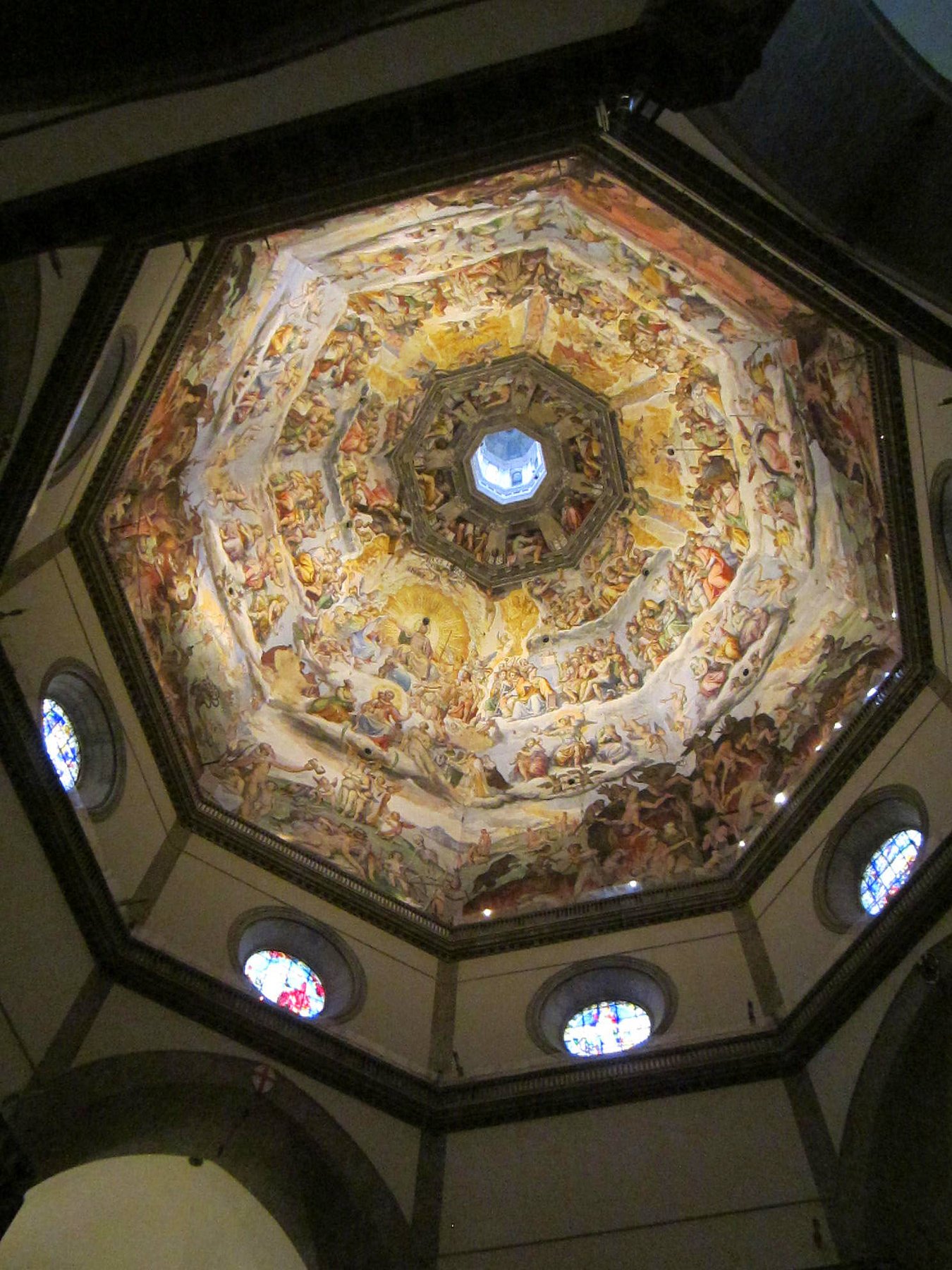 Looking up into the interior of the dome of Florence Cathedral, painted in the late sixteenth century by Vasari and Zuccari with a great fresco of the Last Judgment.